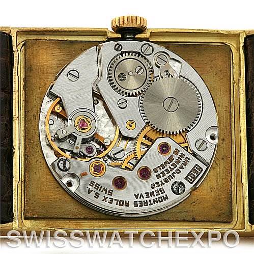 The image shows the movement mechanism of a Rolex Cellini 4127 Men's Yellow Gold Brown Dial 4127 Men's Yellow Gold Brown Dial model watch from a top-down angle with an open case back.