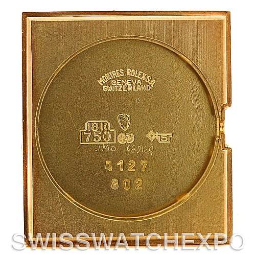 This image shows the back case of a Rolex Cellini 4127 Men's Yellow Gold Brown Dial 4127 Men's Yellow Gold Brown Dial watch, engraved with the brand's details and metal composition.