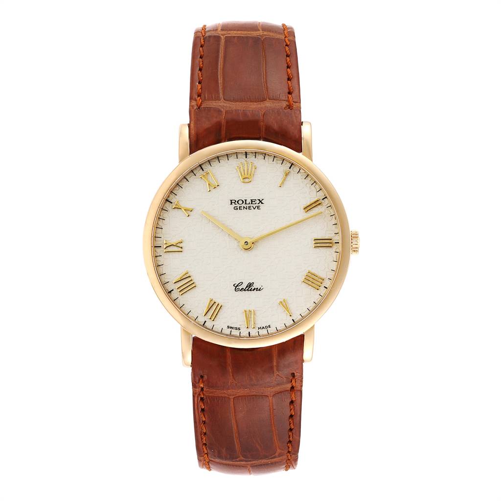 The Rolex Cellini 5112 Men's Yellow Gold Beige Dial 5112 Men's Yellow Gold Beige Dial watch is shown from a front angle, highlighting its white dial, gold Roman numerals, and brown leather strap.