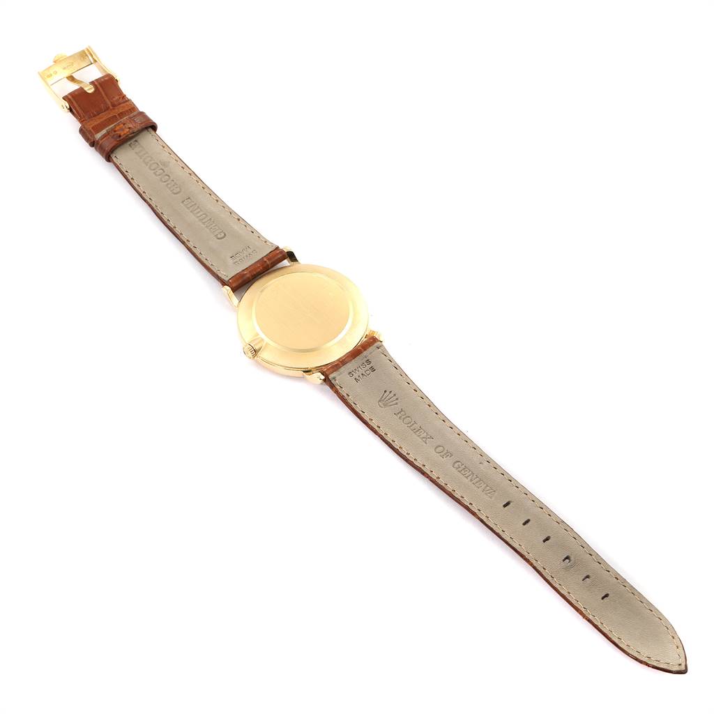 The image shows the back view of a Rolex Cellini 5112 Men's Yellow Gold Beige Dial 5112 Men's Yellow Gold Beige Dial watch, featuring the leather strap and gold case back.