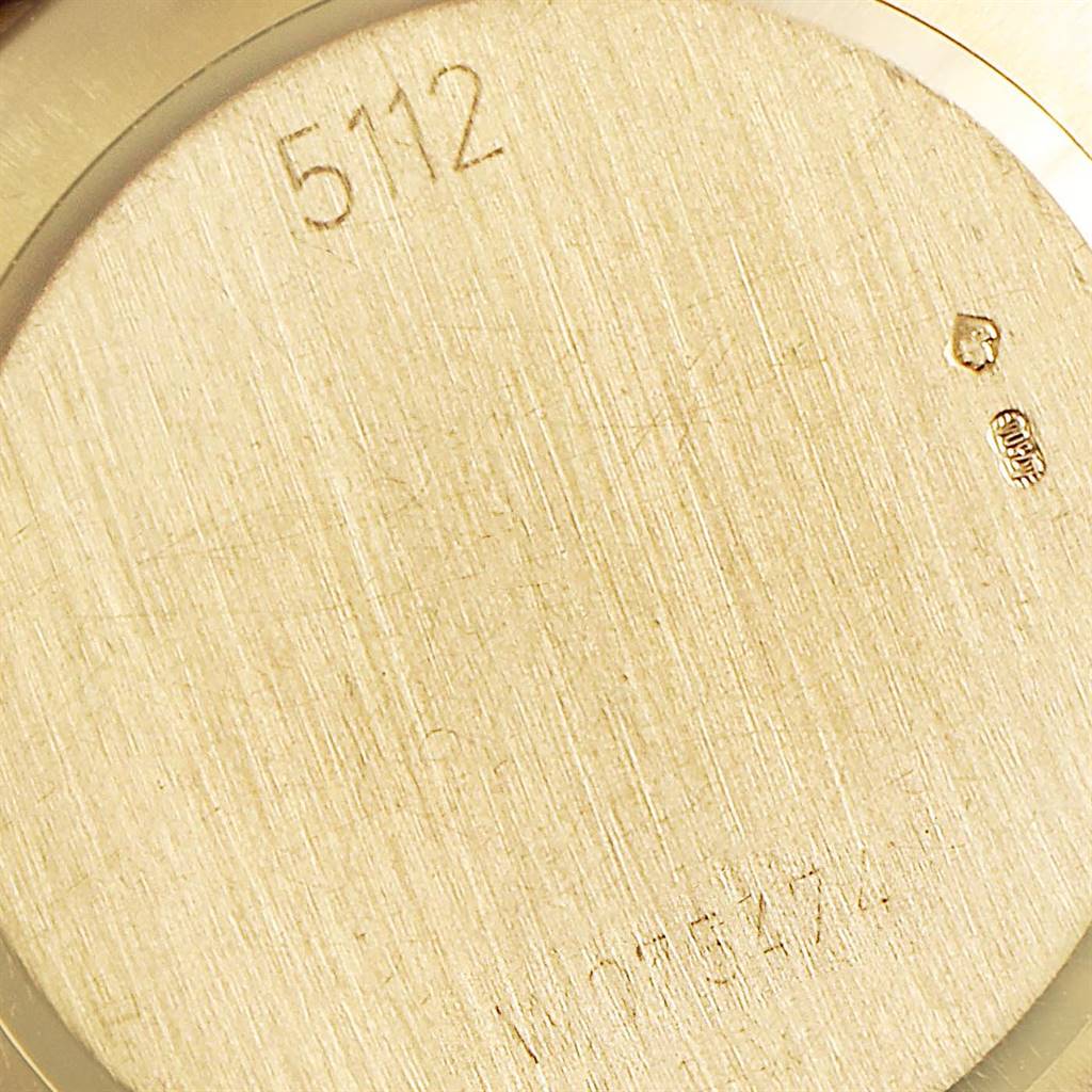 This image shows the back case of a Rolex Cellini 5112 Men's Yellow Gold Beige Dial 5112 Men's Yellow Gold Beige Dial watch with the model number and hallmarks engraved.