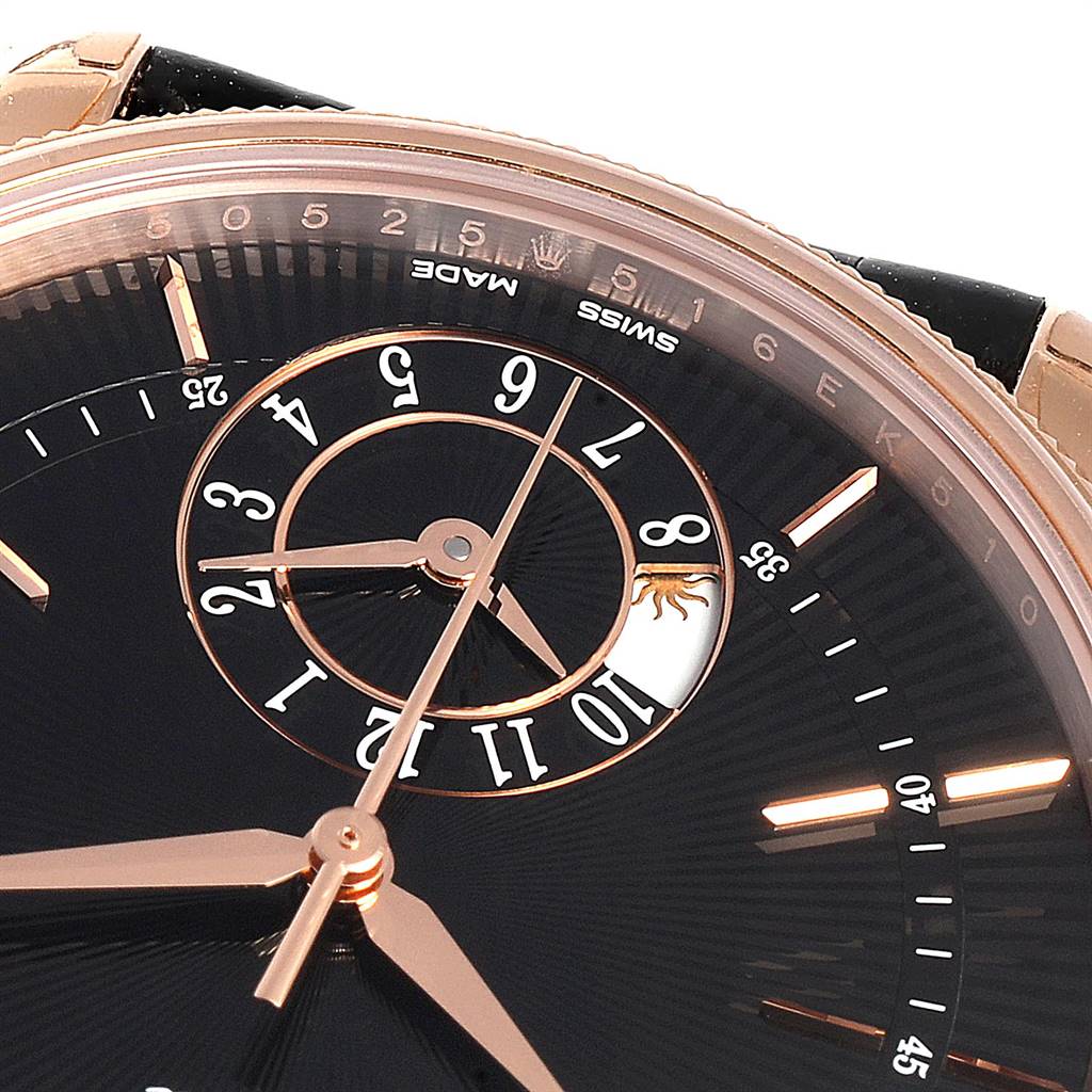 This close-up of the Rolex Cellini 50525 Men's Rose Gold Black Dial 50525 Men's Rose Gold Black Dial watch shows the black dial, gold hands, and a detailed subdial.