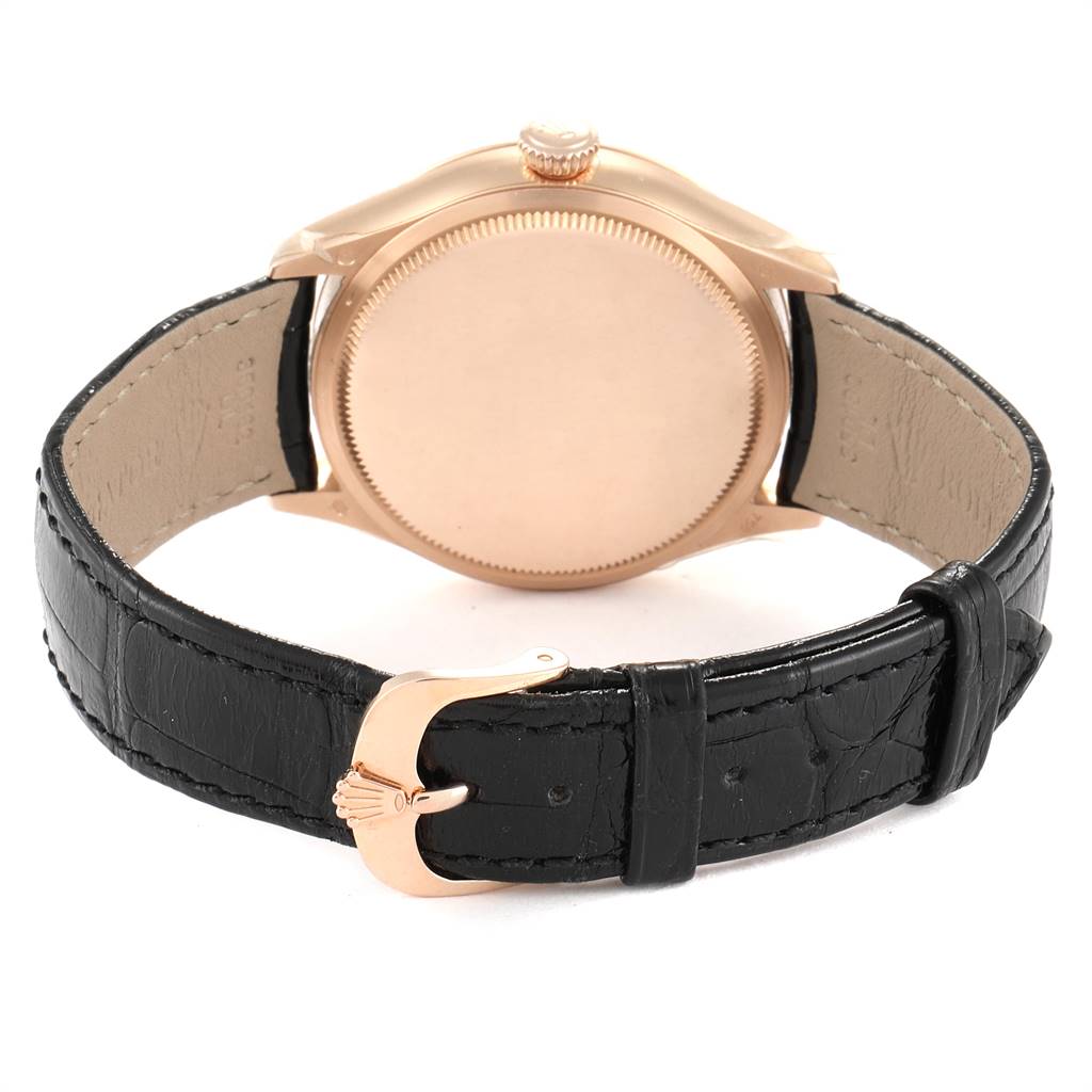The image shows the back view of a Rolex Cellini 50525 Men's Rose Gold Black Dial 50525 Men's Rose Gold Black Dial watch, highlighting its case, crown, and black leather strap with a branded buckle.