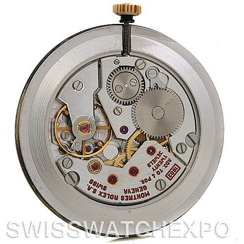 The image shows the inner mechanism of a Rolex Cellini 4112 Yellow Gold Grey Dial 4112 Yellow Gold Grey Dial watch from a rear view angle, revealing gears and components.