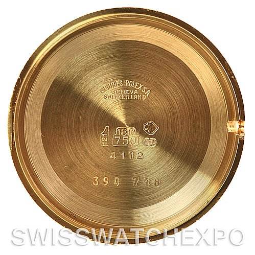 This is the inside case back of a Rolex Cellini 4112 Yellow Gold Grey Dial 4112 Yellow Gold Grey Dial watch, showing brand engravings and hallmark stamps.