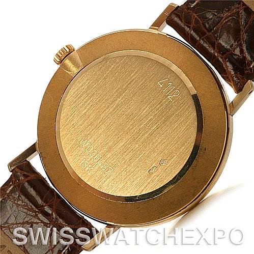 This image shows the back case and leather strap of a Rolex Cellini 4112 Yellow Gold Grey Dial 4112 Yellow Gold Grey Dial watch, with the crown visible on the side.