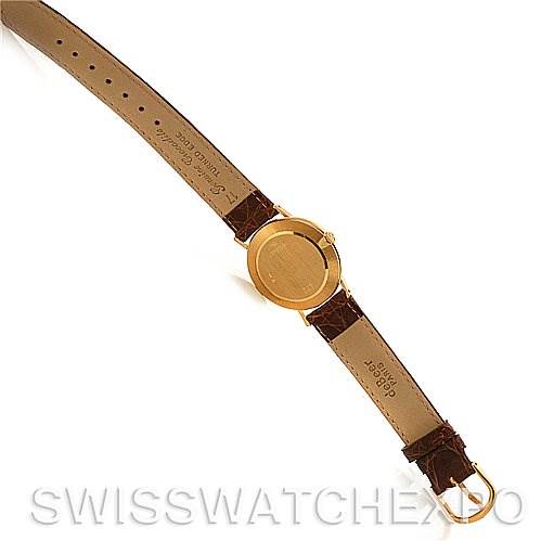 The image shows the back case and leather strap of a Rolex Cellini 4112 Yellow Gold Grey Dial 4112 Yellow Gold Grey Dial watch, laid flat, viewed from the exterior side.