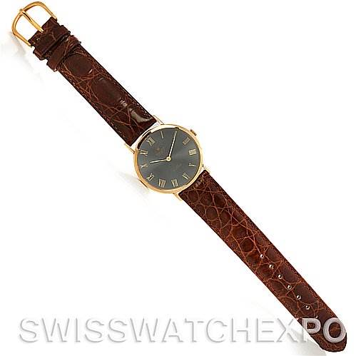 The image shows a full view of a Rolex Cellini 4112 Yellow Gold Grey Dial 4112 Yellow Gold Grey Dial watch, displaying the face, leather strap, and clasp.