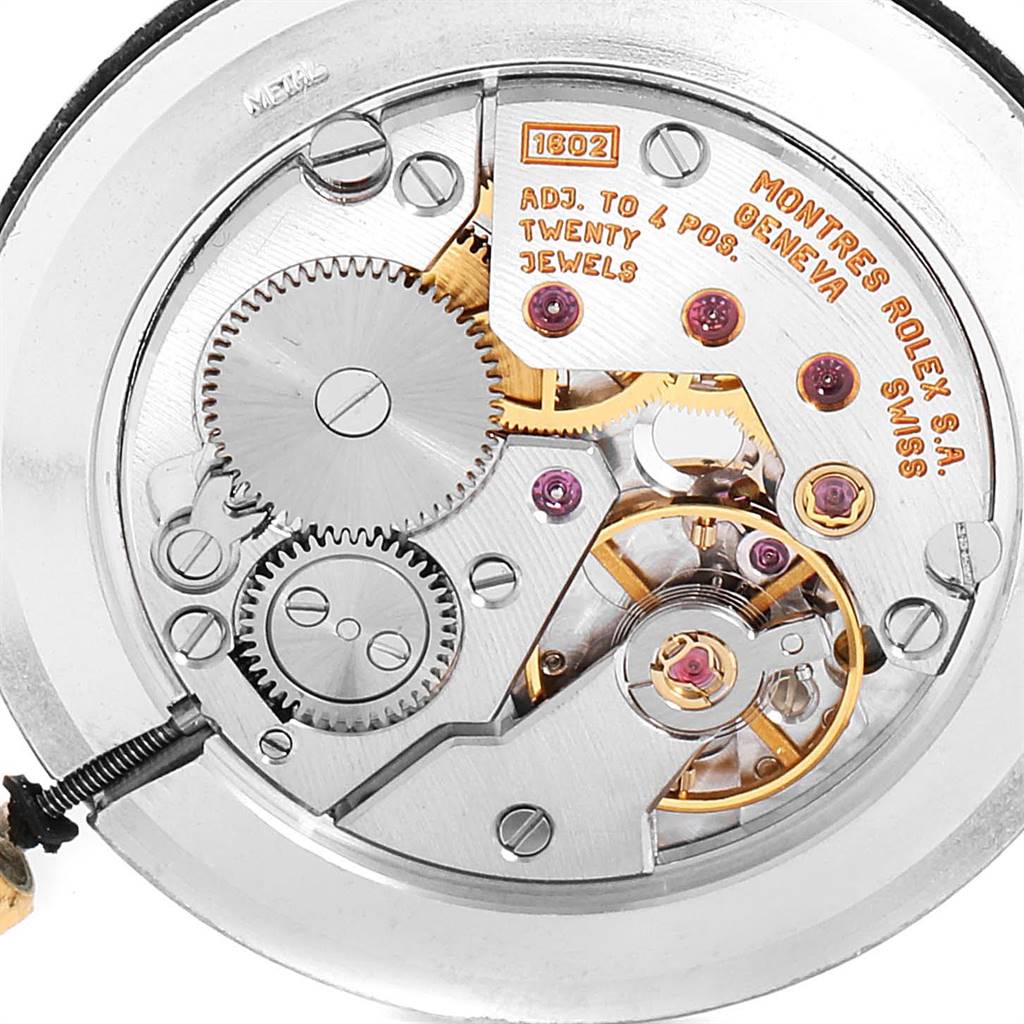 This image shows the intricate movement parts of a Rolex Cellini 5112 Men's Yellow Gold White Dial 5112 Men's Yellow Gold White Dial watch from a close-up angle.