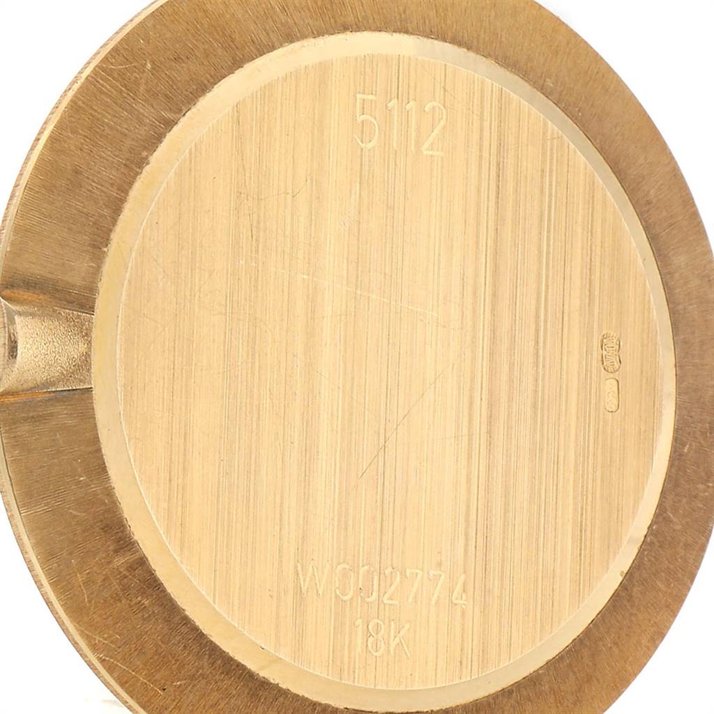 This image shows the case back of a Rolex Cellini 5112 Men's Yellow Gold White Dial 5112 Men's Yellow Gold White Dial watch, taken from a top-down angle.