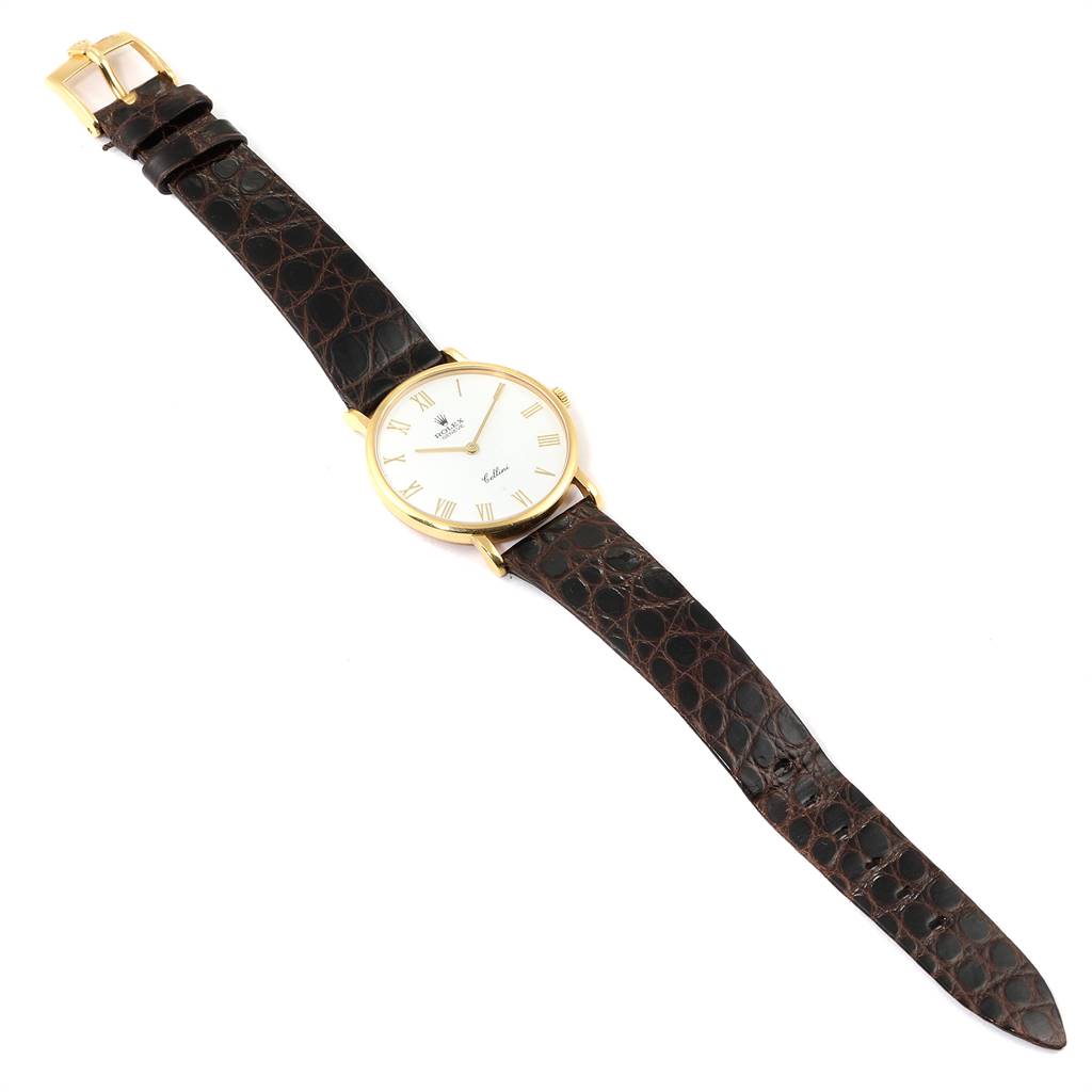 The image shows a Rolex Cellini 5112 Men's Yellow Gold White Dial 5112 Men's Yellow Gold White Dial watch taken from a top-down angle, displaying the face, hands, case, and entire leather strap.
