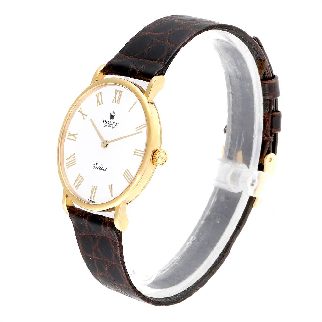 The Rolex Cellini 5112 Men's Yellow Gold White Dial 5112 Men's Yellow Gold White Dial watch is shown at a slight angle displaying its dial, case, crown, and leather strap.