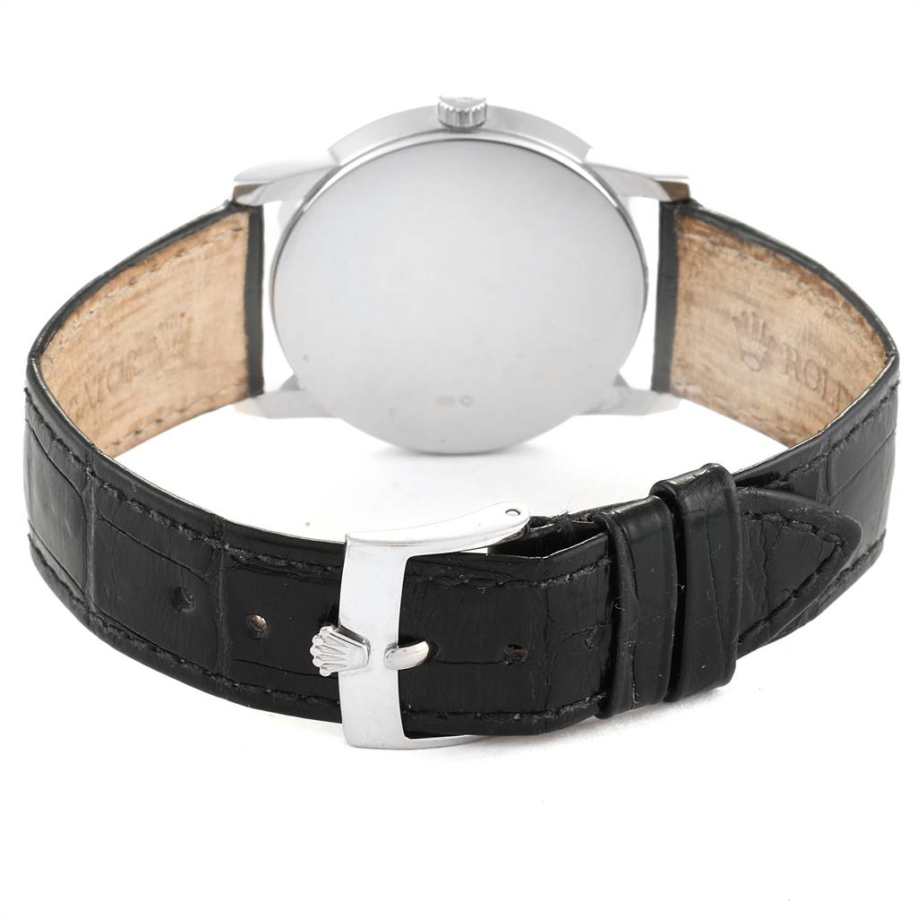 The image shows the back view of a Rolex Cellini 5116 Men's White Gold Silver Dial 5116 Men's White Gold Silver Dial model watch, highlighting its leather strap and buckle.