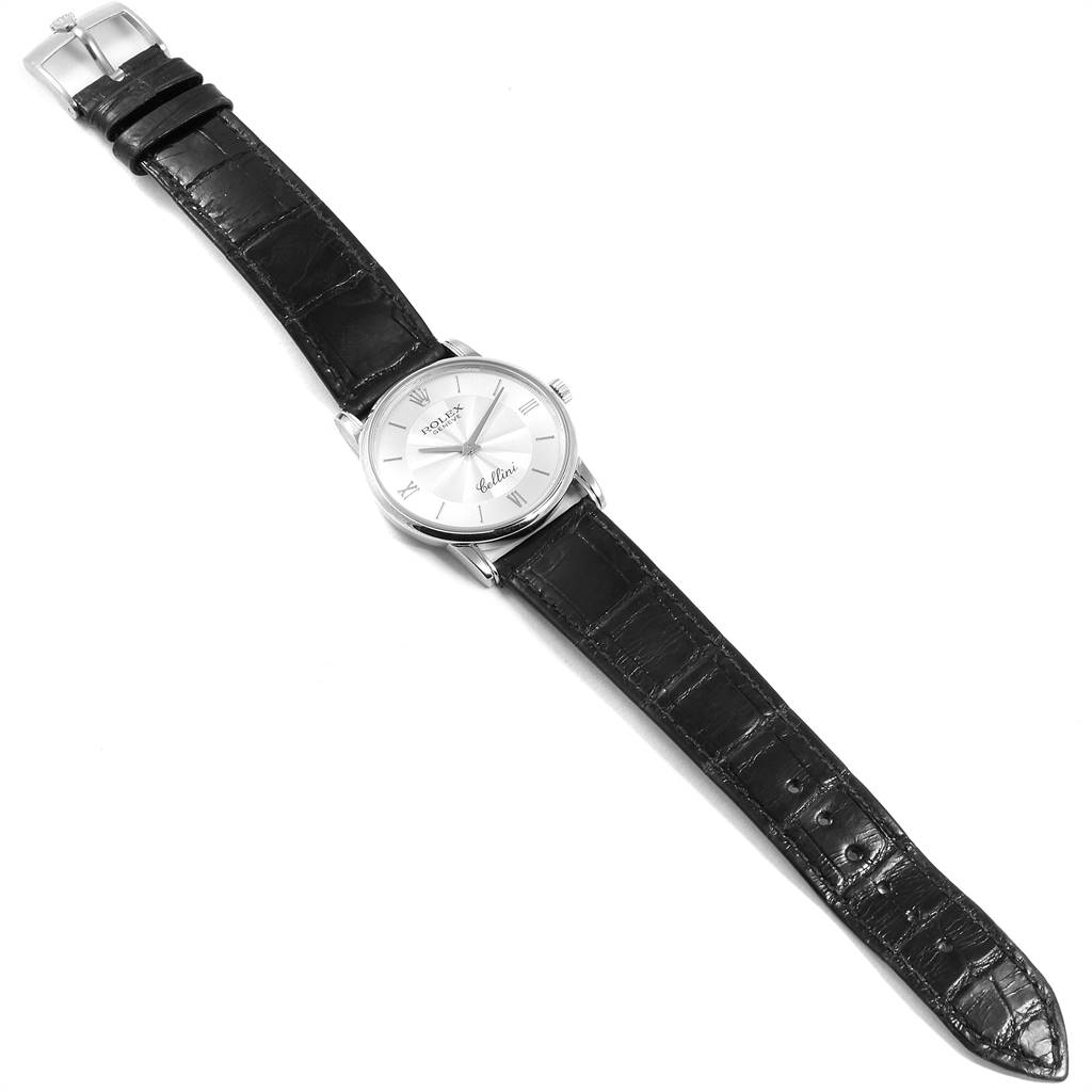 The Rolex Cellini 5116 Men's White Gold Silver Dial 5116 Men's White Gold Silver Dial watch is shown from a top-down angle, displaying the face, black leather strap, and buckle.