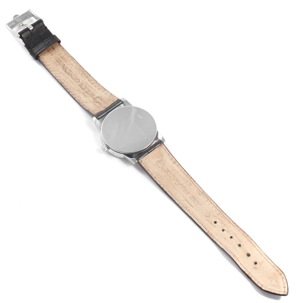 The image shows the back view of a Rolex Cellini 5116 Men's White Gold Silver Dial 5116 Men's White Gold Silver Dial watch, displaying the leather strap and the case back.