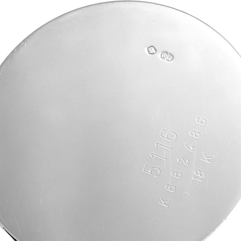 This is a close-up of the back case of a Rolex Cellini 5116 Men's White Gold Silver Dial 5116 Men's White Gold Silver Dial watch, showing the serial number and gold markings.