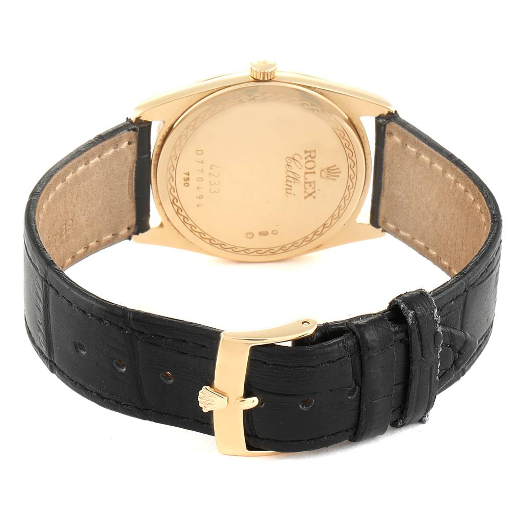 This is a rear view of the Rolex Cellini 4233 Men's Yellow Gold Black Dial 4233 Men's Yellow Gold Black Dial watch, displaying the case back, crown, strap, and buckle.
