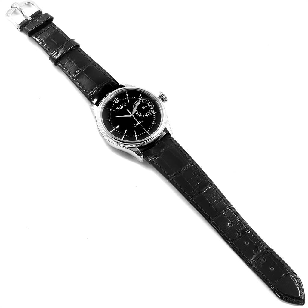 The image shows a top-down view of a Rolex Cellini 50519 Men's White Gold Black Dial 50519 Men's White Gold Black Dial watch, highlighting the black dial, leather strap, and watch case.