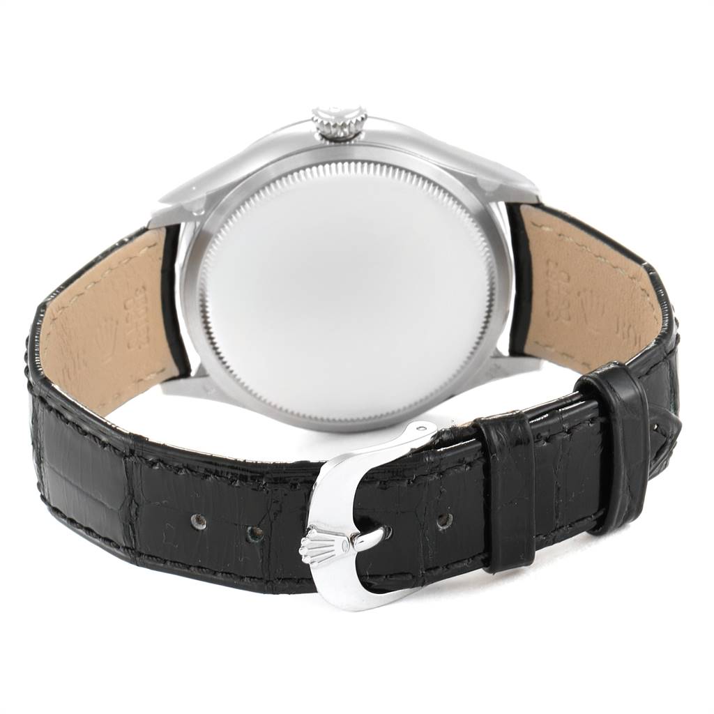 The image shows the back view of a Rolex Cellini 50519 Men's White Gold Black Dial 50519 Men's White Gold Black Dial watch, highlighting the case back and the black leather strap with a clasp.