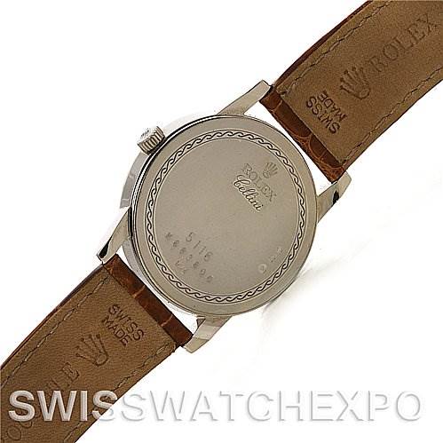 The image shows the back case of a Rolex Cellini 5116/9 White Gold Beige Dial 5116/9 White Gold Beige Dial watch along with parts of the leather strap.