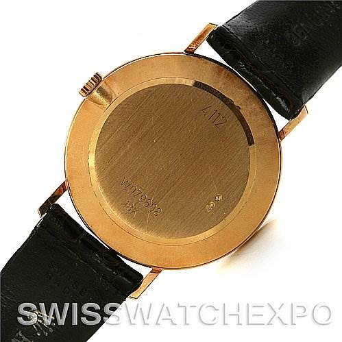 This image shows the back view of a Rolex Cellini 4112 Yellow Gold White Dial 4112 Yellow Gold White Dial watch with its black leather strap and gold case.
