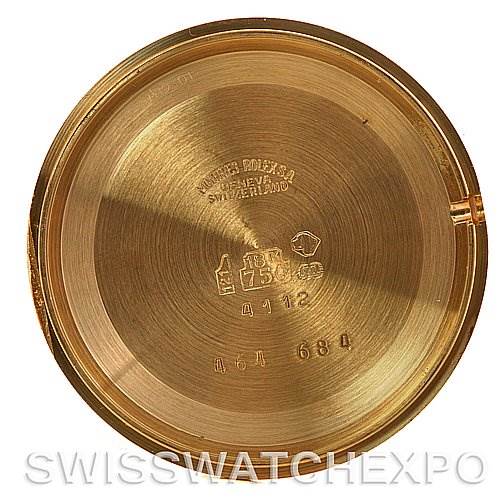 This image shows the inside case back of a Rolex Cellini 4112 Yellow Gold White Dial 4112 Yellow Gold White Dial watch, highlighting the engraved markings and serial numbers.