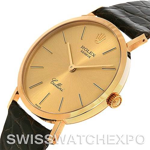 This image shows the Rolex Cellini 4112 Yellow Gold Champagne Dial 4112 Yellow Gold Champagne Dial watch at an angle highlighting the dial, case, crown, and parts of the leather strap.