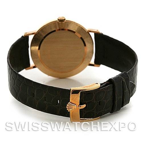 The image shows the back case and strap of a Rolex Cellini 4112 Yellow Gold Champagne Dial 4112 Yellow Gold Champagne Dial watch from a rear-view angle.