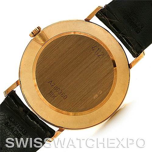 This image shows the back case of a Rolex Cellini 4112 Yellow Gold Champagne Dial 4112 Yellow Gold Champagne Dial watch, including the strap attachment and engravings on the case.