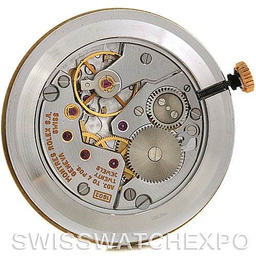 This image shows a close-up view of the movement of a Rolex Cellini 4112 Yellow Gold Champagne Dial 4112 Yellow Gold Champagne Dial watch, highlighting its internal gears and components.