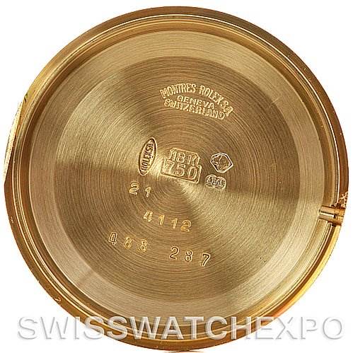 The image shows the inner case back of a Rolex Cellini 4112 Yellow Gold Champagne Dial 4112 Yellow Gold Champagne Dial watch with various engravings and hallmarks visible.