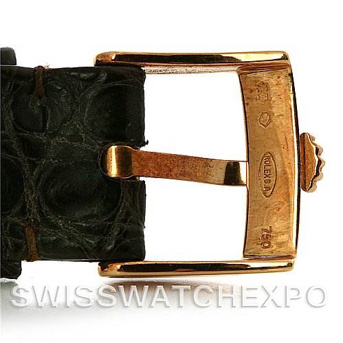 The image shows a close-up of the gold buckle and leather strap of a Rolex Cellini 4112 Yellow Gold Champagne Dial 4112 Yellow Gold Champagne Dial watch.