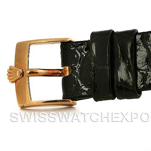 The image shows the buckle and part of the leather strap of a Rolex Cellini 4112 Yellow Gold Champagne Dial 4112 Yellow Gold Champagne Dial watch.