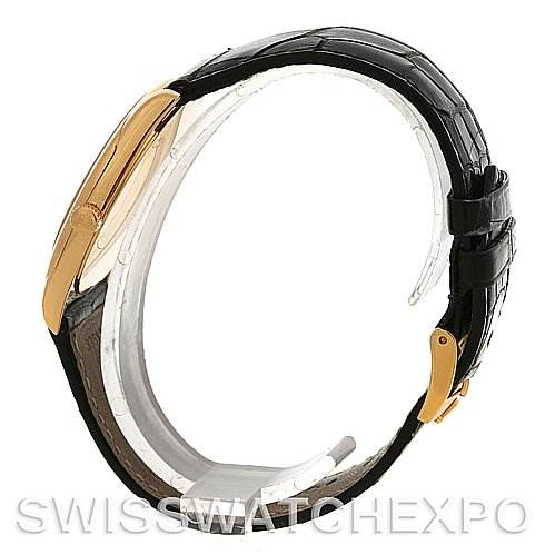 The image shows a side view of a Rolex Cellini 4233 Yellow Gold White Dial 4233 Yellow Gold White Dial watch, highlighting its black leather strap and gold case.