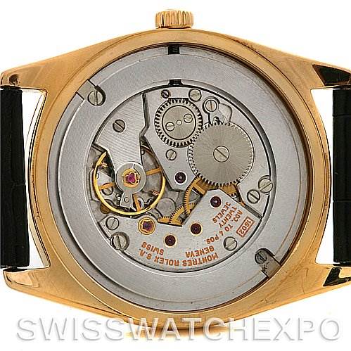 This image shows the back view of a Rolex Cellini 4233 Yellow Gold White Dial 4233 Yellow Gold White Dial watch, highlighting its exposed movement and internal mechanisms.