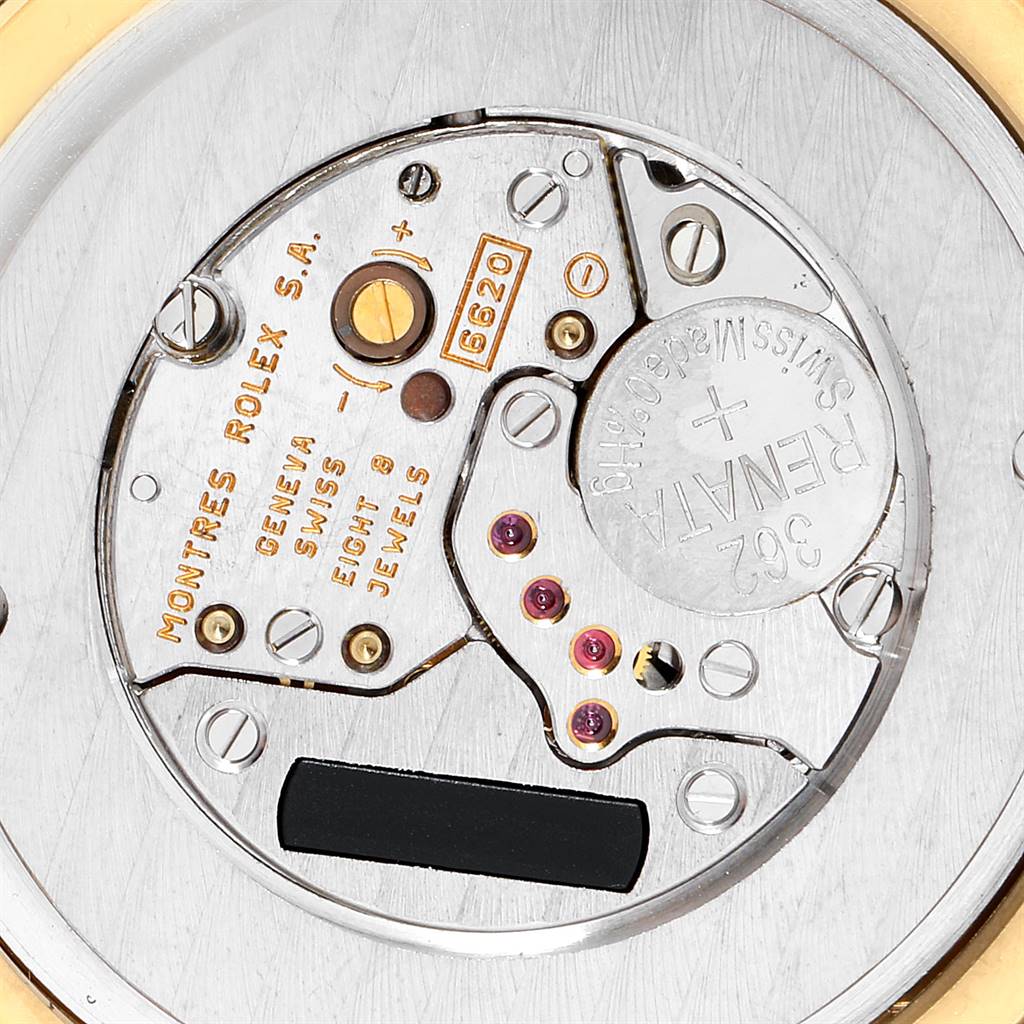 The image shows a close-up of the movement mechanism of a Rolex Cellini 6623 Men's Yellow Gold White Dial 6623 Men's Yellow Gold White Dial watch, highlighting its interior components and jewels.