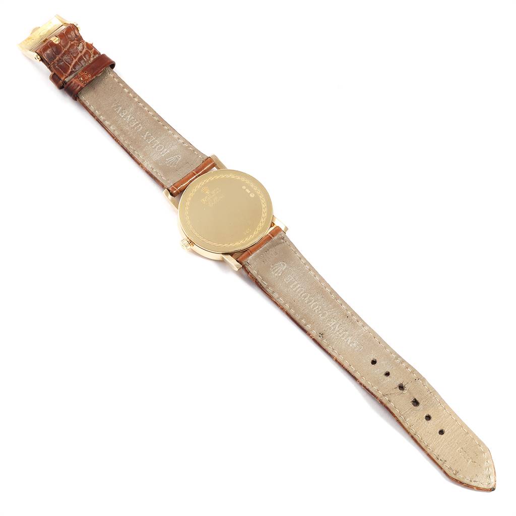 The image shows the back view of a Rolex Cellini 5115 Men's Yellow Gold Beige Dial 5115 Men's Yellow Gold Beige Dial watch, highlighting the case back and leather strap.