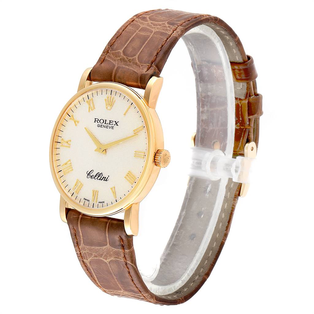 This is a side view of a Rolex Cellini 5115 Men's Yellow Gold Beige Dial 5115 Men's Yellow Gold Beige Dial watch, displaying the brown leather strap, gold casing, and dial with Roman numerals.