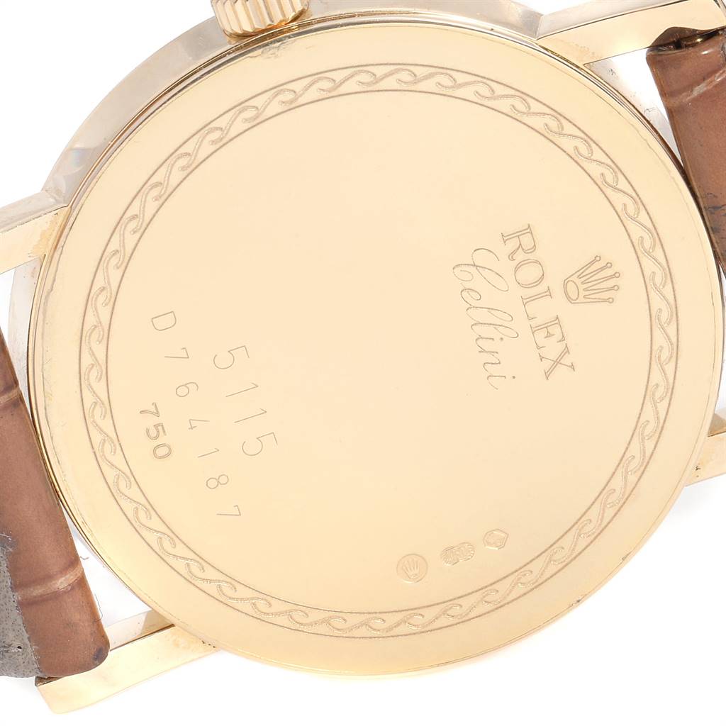 The image shows the back case of a Rolex Cellini 5115 Men's Yellow Gold Beige Dial 5115 Men's Yellow Gold Beige Dial model watch, including the serial number and branding details.