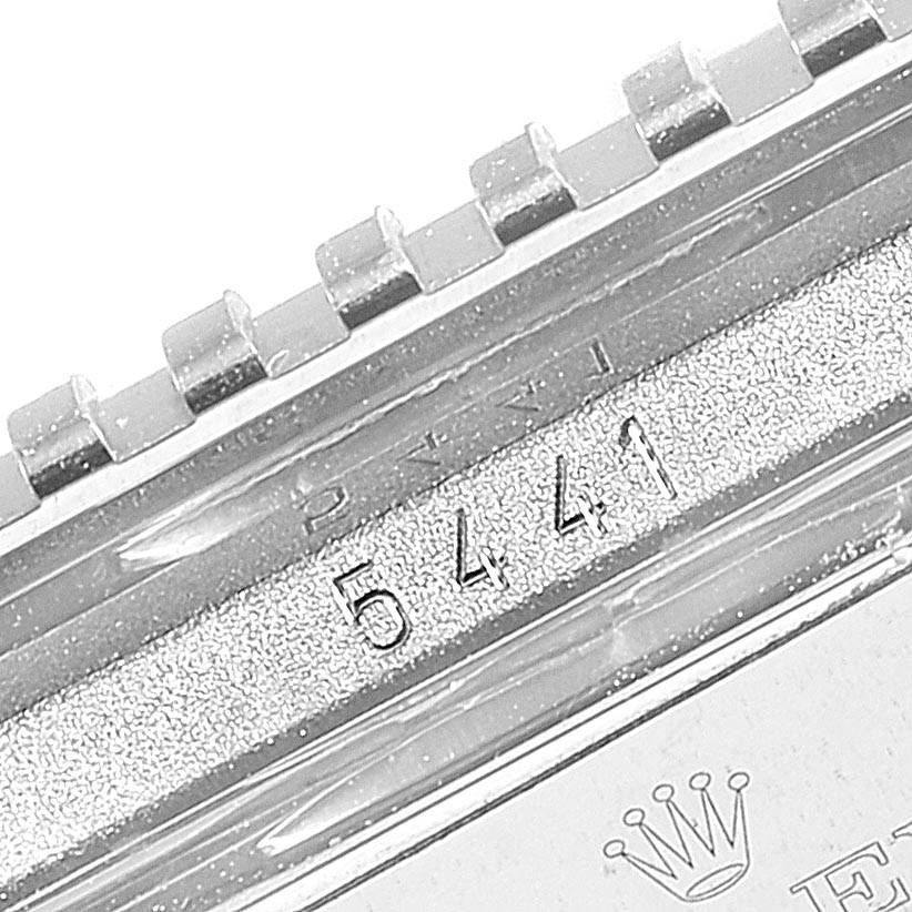 This close-up shows the bezel and part of the case back of a Rolex Cellini 5441 Men's White Gold Silver Dial 5441 Men's White Gold Silver Dial, with the model number 5441 engraved.