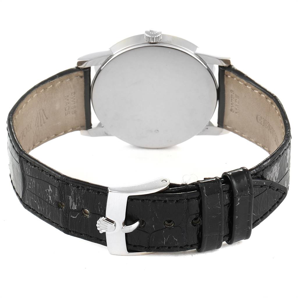 The image shows the back of a Rolex Cellini 5116 Men
s White Gold Silver Dial 5116 Men
s White Gold Silver Dial watch, focusing on its leather strap and buckle.