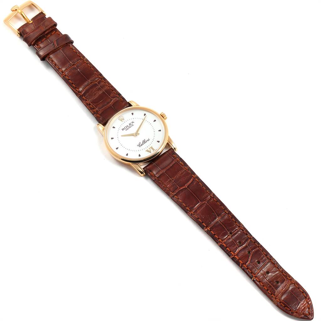 The image shows a Rolex Cellini 5116 Men's Yellow Gold Silver Dial 5116 Men's Yellow Gold Silver Dial watch from a top-down angle, displaying its face, brown leather strap, and gold buckle.