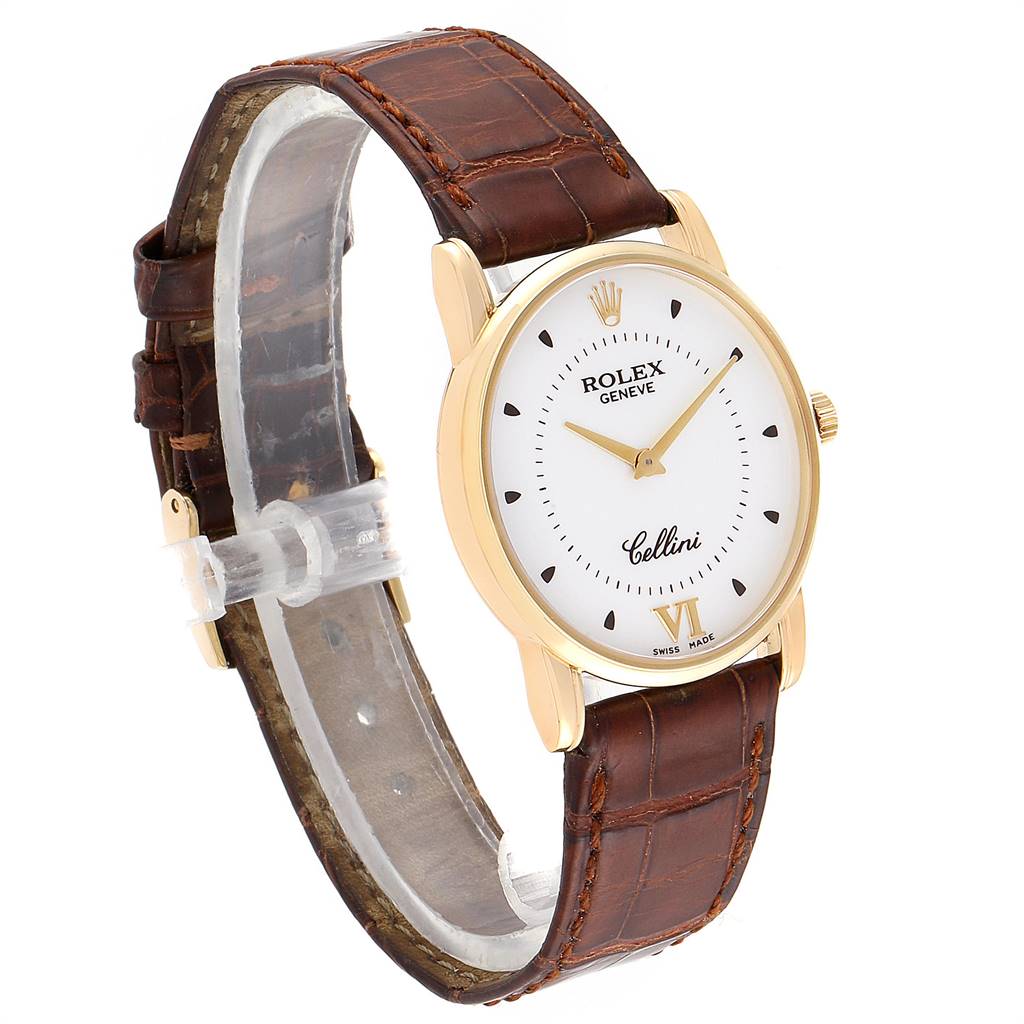 The image shows a Rolex Cellini 5116 Men's Yellow Gold Silver Dial 5116 Men's Yellow Gold Silver Dial watch at an angled side view, highlighting its white dial, gold case, and brown leather strap.