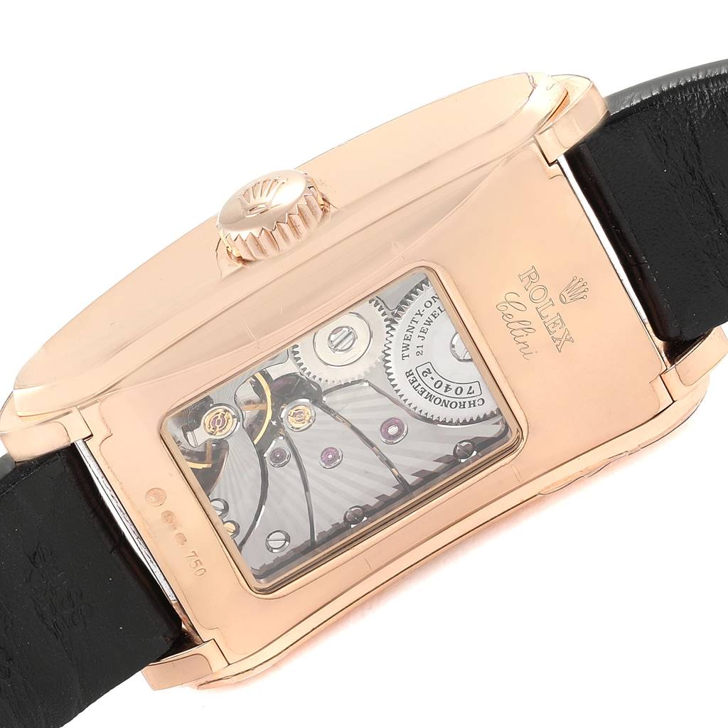 This image shows the back and crown of the Rolex Cellini 5442 Men's Rose Gold Black Dial 5442 Men's Rose Gold Black Dial model watch, highlighting its internal mechanics and black strap.