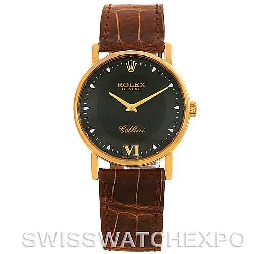 The image shows a front view of a Rolex Cellini 5115 Yellow Gold Black Dial 5115 Yellow Gold Black Dial watch with a brown leather strap and gold-tone case.
