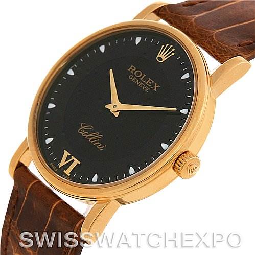 The image shows a side angle view of a Rolex Cellini 5115 Yellow Gold Black Dial 5115 Yellow Gold Black Dial watch, highlighting the black dial, gold case, and brown leather strap.