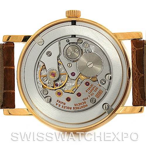 This image shows the back view of a Rolex Cellini 5115 Yellow Gold Black Dial 5115 Yellow Gold Black Dial watch, highlighting its movement and inner mechanical parts.