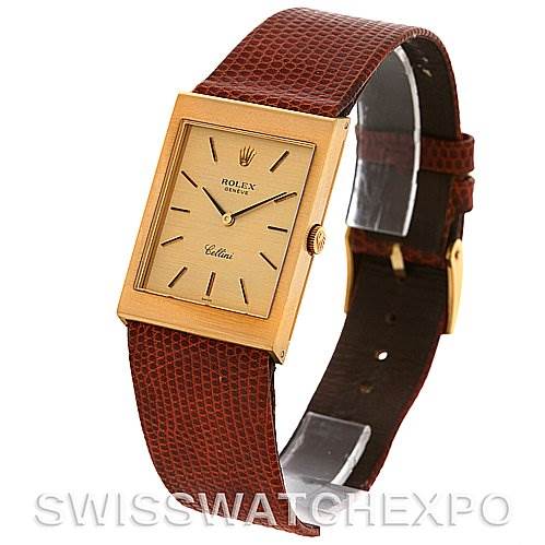 The image shows a Rolex Cellini 4027 Men
s Yellow Gold Champagne Dial 4027 Men
s Yellow Gold Champagne Dial watch at an angle highlighting the face, bezel, crown, and brown leather strap.