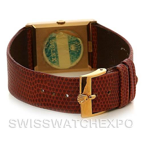 The image shows the Rolex Cellini 4027 Men
s Yellow Gold Champagne Dial 4027 Men
s Yellow Gold Champagne Dial watch from the back, displaying the clasp and the stamped case back.