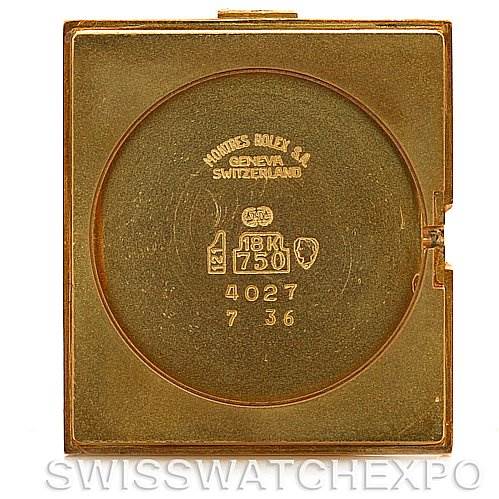 The image shows the back cover of a Rolex Cellini 4027 Men
s Yellow Gold Champagne Dial 4027 Men
s Yellow Gold Champagne Dial watch, highlighting the inscriptions and gold stamps.